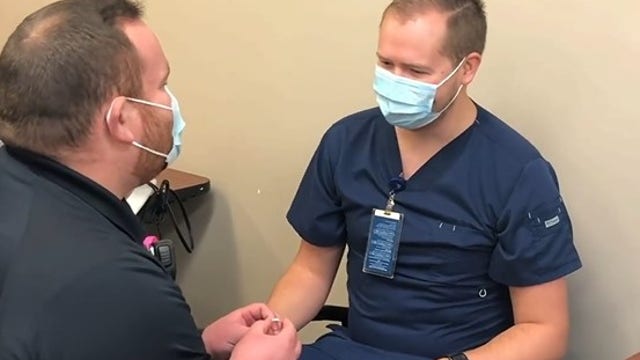EMS worker proposes to nurse during COVID-19 vaccine appointment