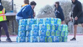 City of Austin distributes cases of water to people in need