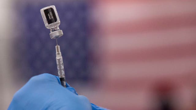 US daily coronavirus case average drops below 100K for first time in months