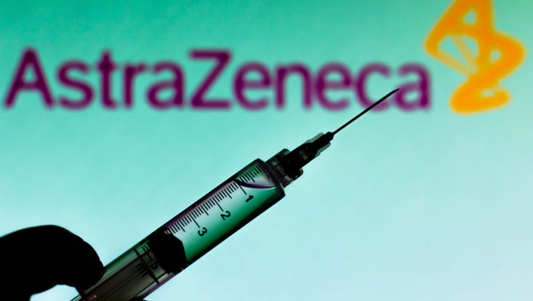 7c52904e-In this photo illustration a medical syringe is seen with