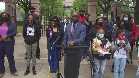 Local groups hold rally expressing opposition to voting bill