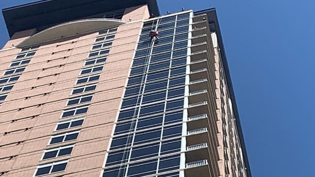 ATCEMS: Dangling window washer safe, unharmed