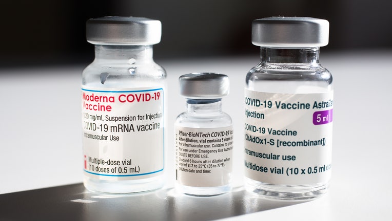 In this photo illustration vials containing Pfizer-BioNtech