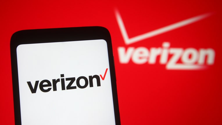 In this photo illustration, Verizon logo seen displayed on a