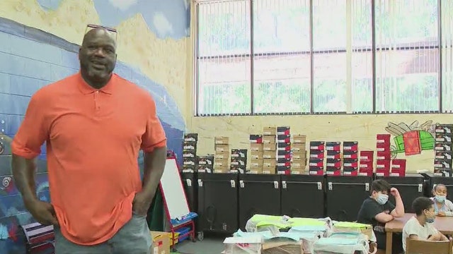 Shaq helps gift hundreds of new shoes to elementary school students