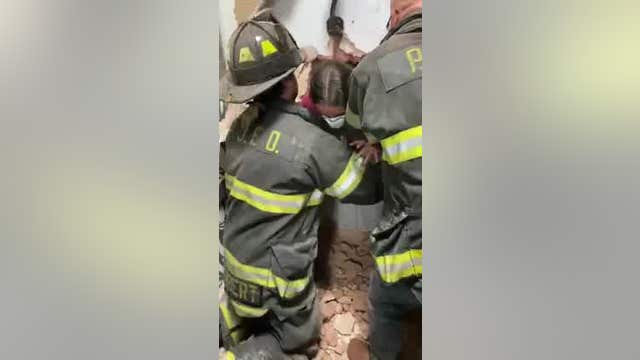 Girl stuck in dressing room pulled through wall to safety