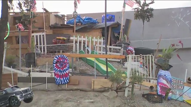 Photos: Gardener experiencing homelessness builds 'Hillside Estate' near freeway