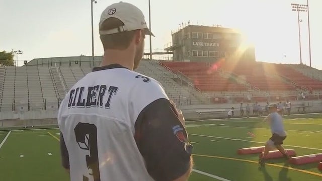 QB Garrett Gilbert returns to Lake Travis HS for football camp