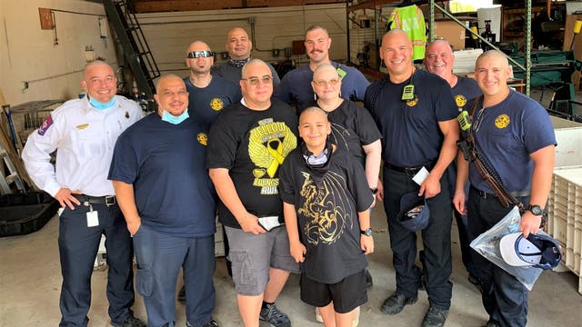 AFD members shave their heads to support boy with bone cancer