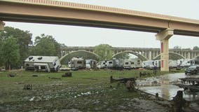 One RV swept away, another turned on its side following heavy rain