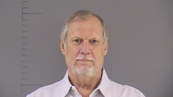 Man arrested for killing driver of 'suspicious vehicle' outside his home