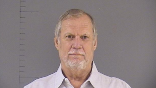 Man arrested for killing driver of 'suspicious vehicle' outside his home