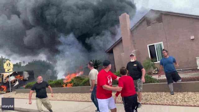 VIDEO: Bystanders rescue woman from burning home after plane crashes, killing 2 in SoCal