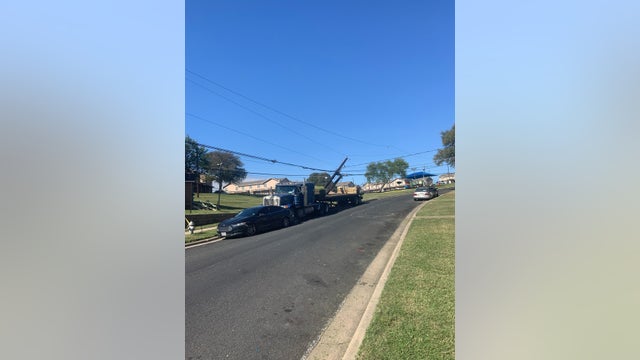 18-wheeler takes out power poles in East Austin, avoid the area