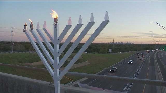 Menorah lit over MoPac in same location anti-Semitic banners were placed