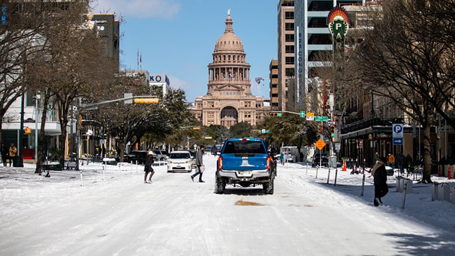 AUSTIN, TX - FEBRUARY 15: The Texas Capitol is surrounded by snow on February 15, 2021 in Austin, Texas. Winter storm Uri has brought historic cold weather to Texas, causing traffic delays and power outages, and storms have swept across 26 states with a mix of freezing temperatures and precipitation. (Photo by Montinique Monroe/Getty Images)