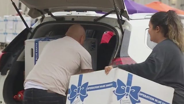 APD Operation Blue Santa volunteers deliver boxes despite rainy day