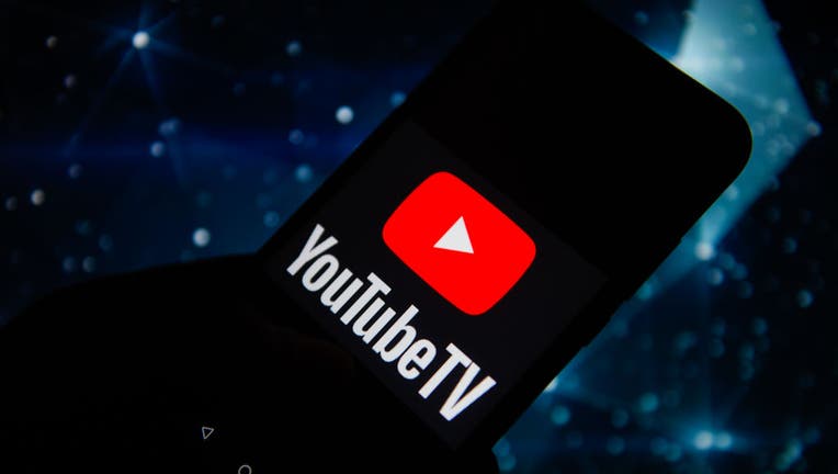 In this photo illustration a Youtube TV logo seen displayed