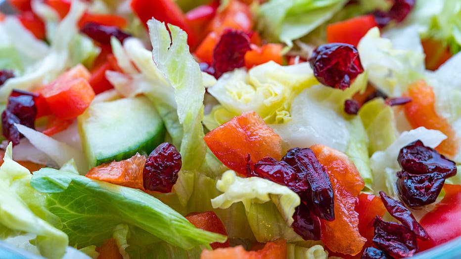 Delicious lettuce salad with cucumbers, red peppers and