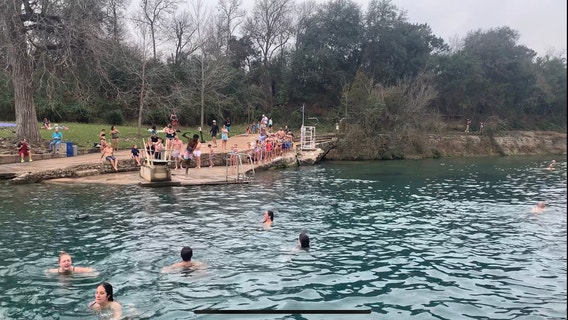 Austinites take part in Polar Bear Plunge at Barton Springs