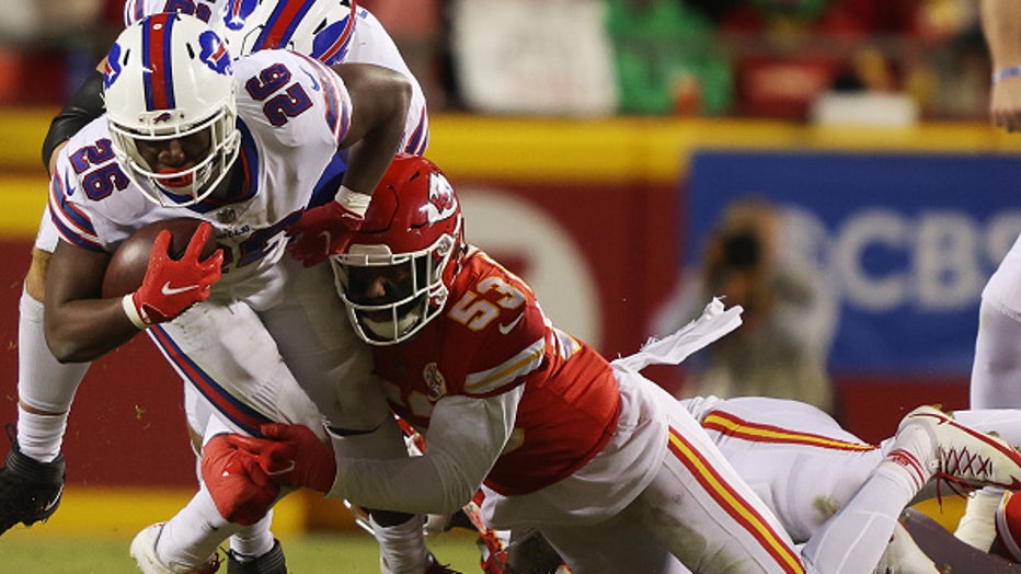 KANSAS CITY, MISSOURI - JANUARY 23: Anthony Hitchens #53 of the Kansas City Chiefs tackles Devin Singletary #26 of the Buffalo Bills during the AFC Divisional Playoff game at Arrowhead Stadium on January 23, 2022 in Kansas City, Missouri. (Photo by Jamie Squire/Getty Images)