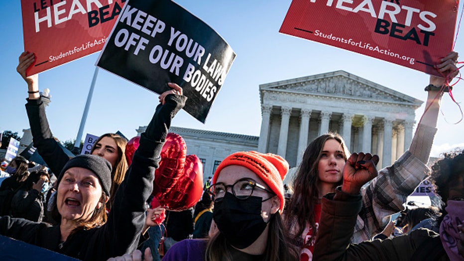 WASHINGTON, DC - NOVEMBER 1: Pro-life and pro-choice protestors gather outside the Supreme Court as arguments begin about the Texas abortion law by the court on Capitol Hill on Monday, Nov. 01, 2021 in Washington, DC. (Photo by Jabin Botsford/The Washington Post via Getty Images)