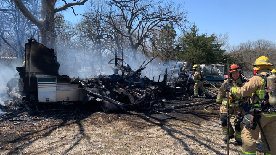 The fire reportedly involved an RV and spread to the surrounding grass and debris in the boat storage yard in northeast Austin.