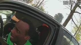 Body camera footage shows officers saving boy in stolen car