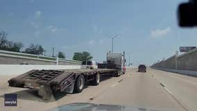 Video shows tiny toy truck being transported on hulking flatbed truck in Texas