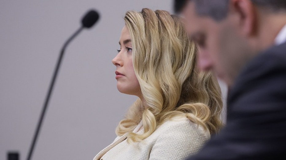 Actress Amber Heard attends the defamation trial against her at the Fairfax County Circuit Courthouse in Fairfax, Virginia, April 20, 2022. - Actor Johnny Depp sued ex-wife Heard for libel after she wrote an op-ed piece in The Washington Post in 2018 referring to herself as a public figure representing domestic abuse. (Photo by EVELYN HOCKSTEIN / POOL / AFP) (Photo by EVELYN HOCKSTEIN/POOL/AFP via Getty Images)