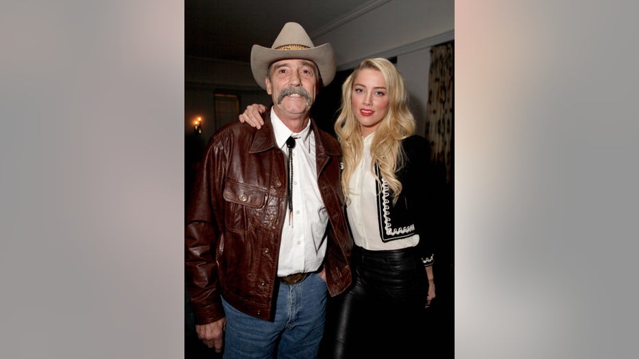 Actress Amber Heard and father David Heard attend Lisa Hoffman Fragrance Jewelry Event 2012 at Chateau Marmont on January 27, 2012 in Los Angeles, California. (Photo by Jeff Vespa/WireImage)