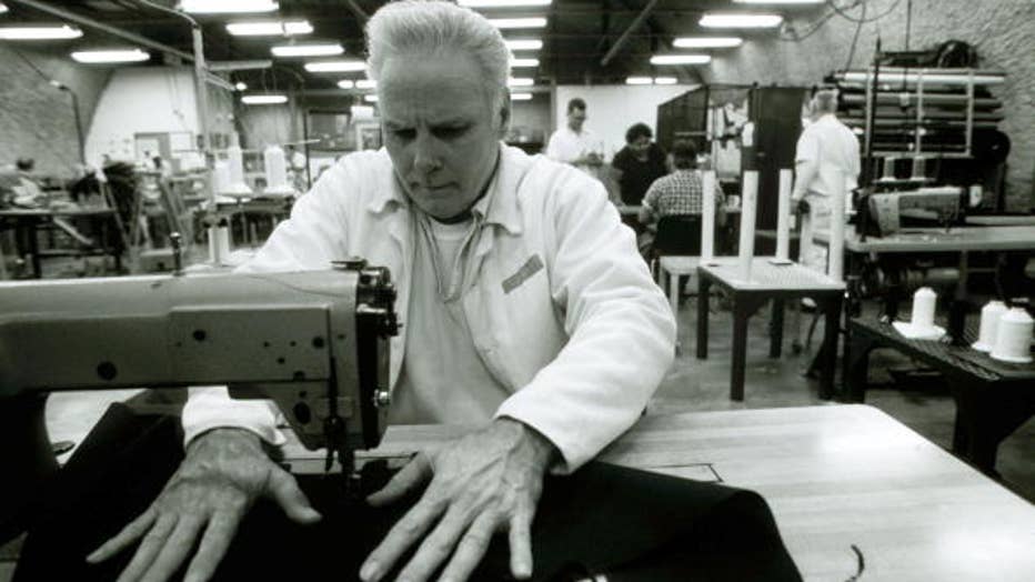 Texas Death Row inmate Carl Buntion works in the sewing factory April 12, 1997 at Ellis Unit in Huntsville, Texas USA. As a model prisoner he is allowed to work. He has a wife and two children in Houston, Texas. The state of Texas executes the most prisoners in the US. (Photo by Per-Anders Pettersson/Liaison)