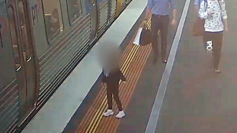 Storyful-271714-Little_Girl_Left_Behind_on_Rail_Platform_Reunited_With_Mother.mp4_.00_00_05_24.Still002-copy.jpg