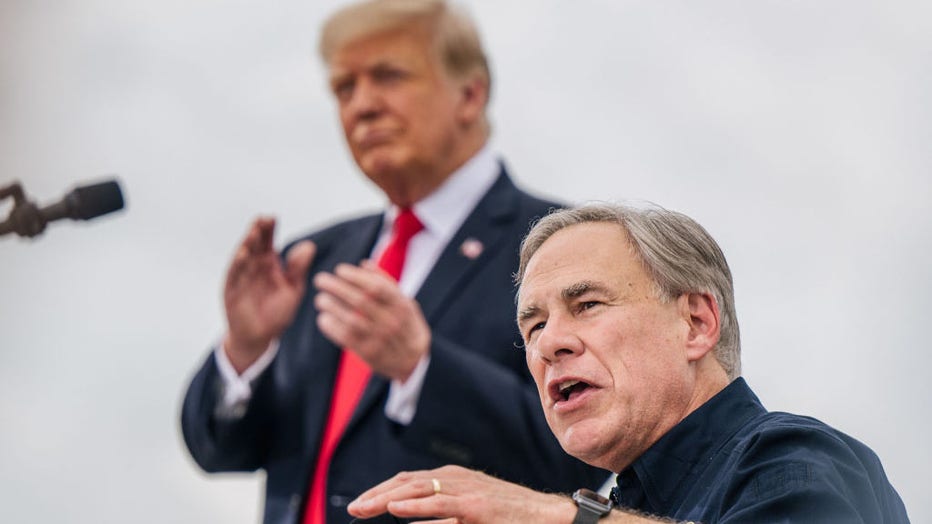 FILE IMAGE - Texas Gov. Greg Abbott speaks alongside former President Donald Trump during a tour of an unfinished section of the border wall on June 30, 2021, in Pharr, Texas. (Photo by Brandon Bell/Getty Images)