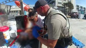 WATCH: New bodycam video shows chaos after car drives across Daytona Beach and into ocean, injuring a child