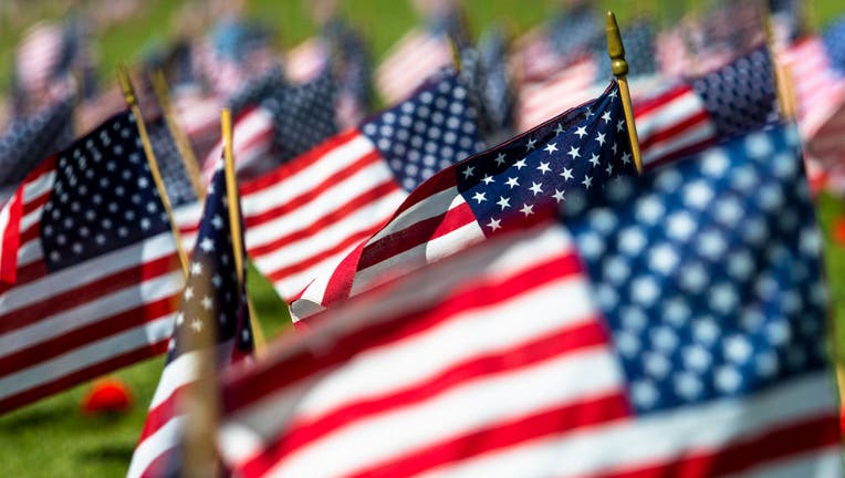 521c649f-American flags seen at a veterans cemetery