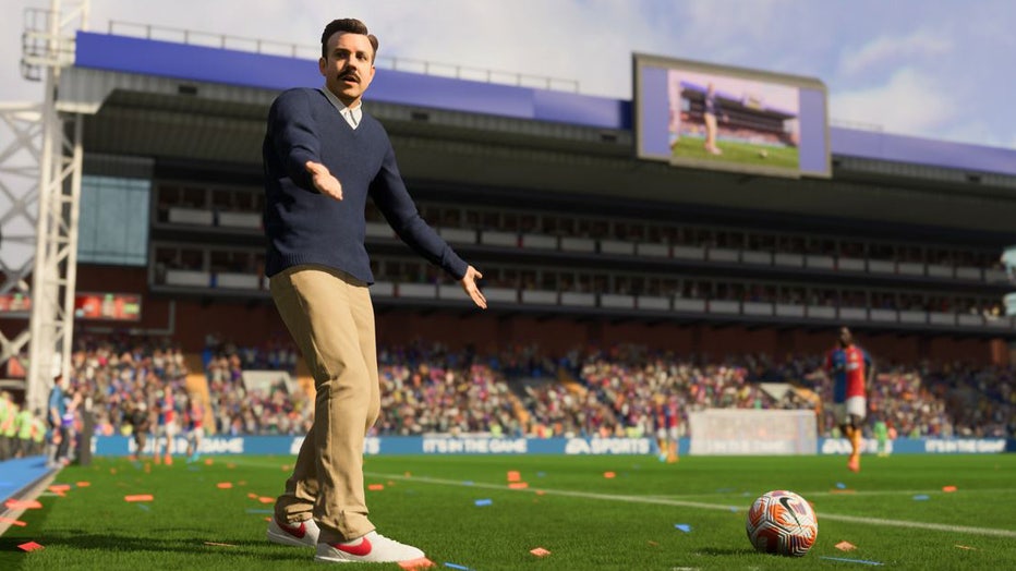 Ted-Lasso-on-field-with-soccer-player-EA-Sports.jpg