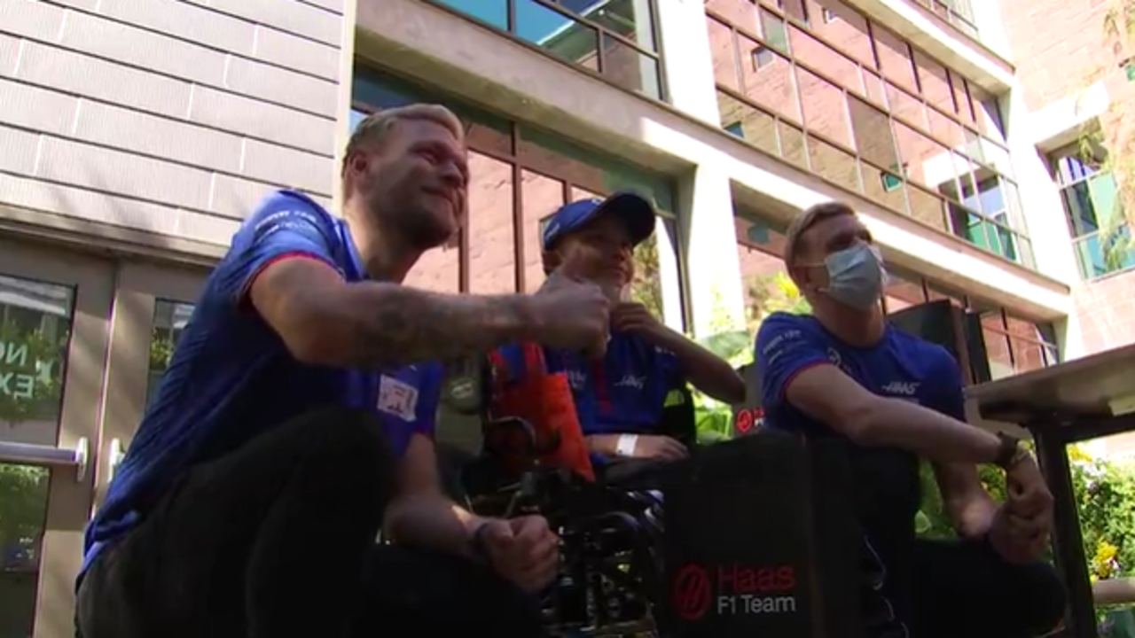 Formula One drivers make pit stop at Dell Children's to hang out, play with kids