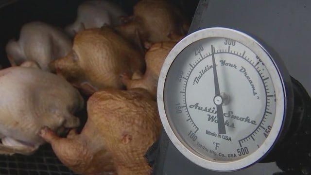 Turkeys smoked for Thanksgiving by Operation Turkey volunteers at Rodeo Austin grounds