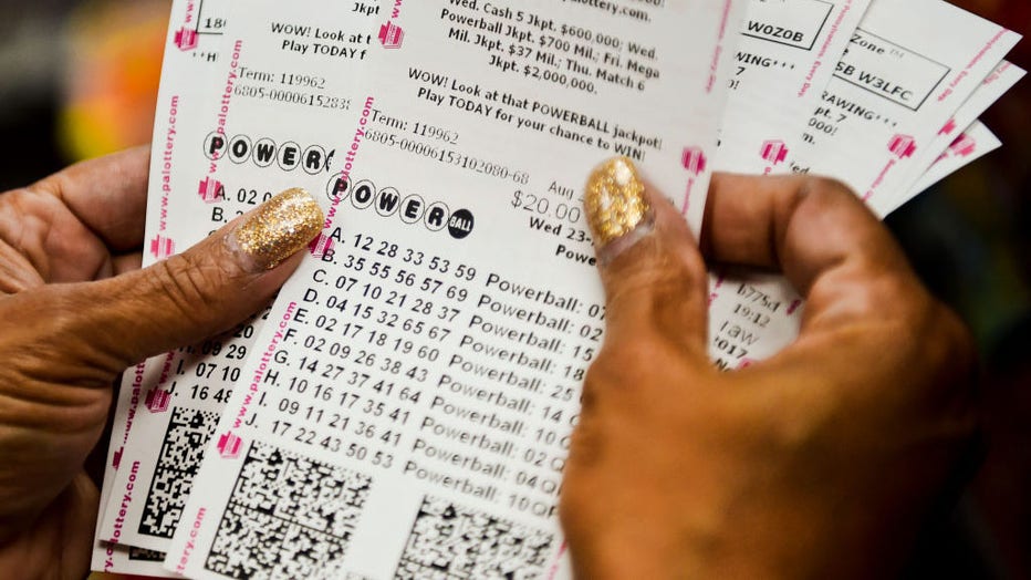 Doris Natal of Reading checks out her 126 Powerball tickets as part of a pool with the Berks County Sheriff's Office at the Sunoco in Exeter. Photo by Natalie Kolb 8/23/2017