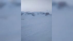 Buried in snow, semi truck drivers spend days trapped at South Dakota fuel stop