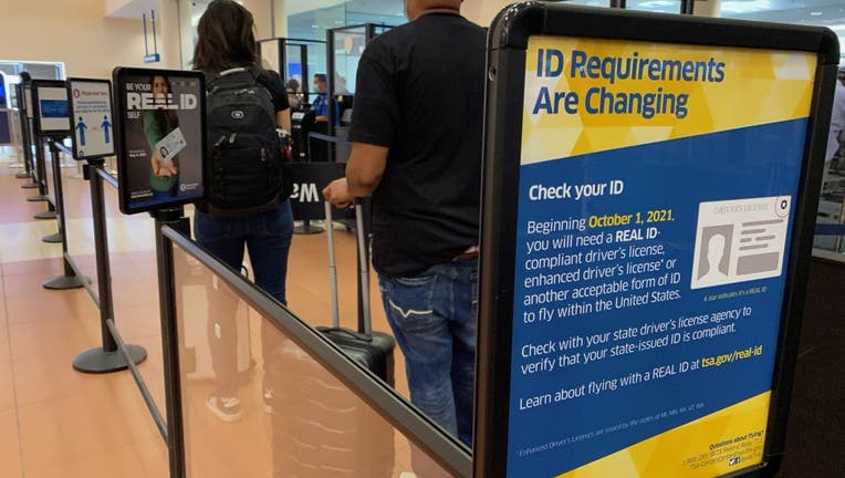 ID requirement signs at entrance to passenger TSA security area, West Palm Beach, Florida