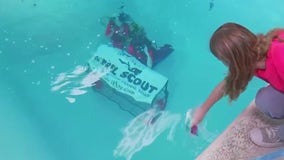 Nation's first Girl Scout Scuba Troop holds underwater cookie sale in Austin