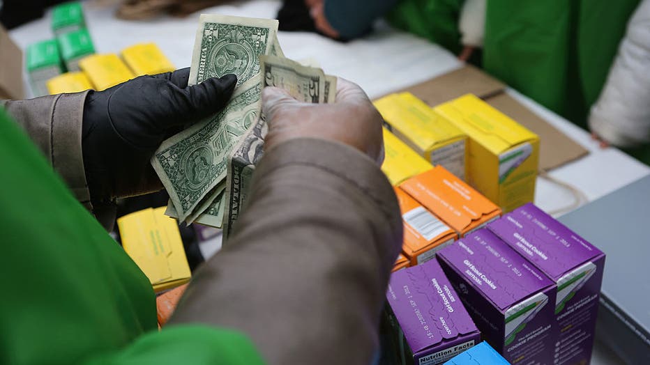 4684c79a-Girl Scouts Sell Cookies From Street Trucks In New York City