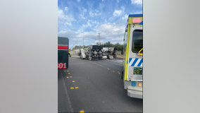 Driver trapped, all lanes shut down on SH 71 after cement truck overturned