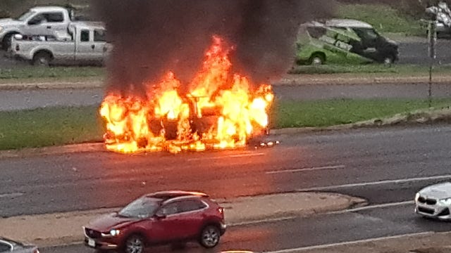 Car fire closes I-35 northbound frontage road at Riverside