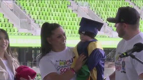 NICU babies and their families graduate in ceremony at Q2 Stadium