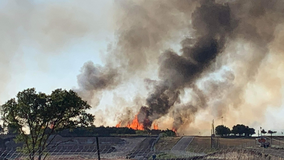 Fire crews work to control 100-acre grass fire near Travis County Expo Center