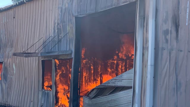 Fire in abandoned building spreads to grass in NW Austin