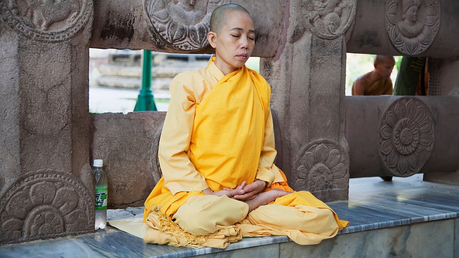 Buddhist-meditates-in-temple.jpg